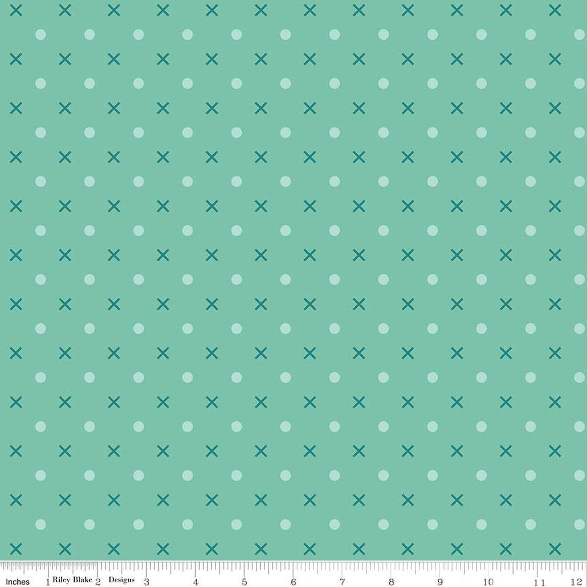 geometric print features an array of x's and dots