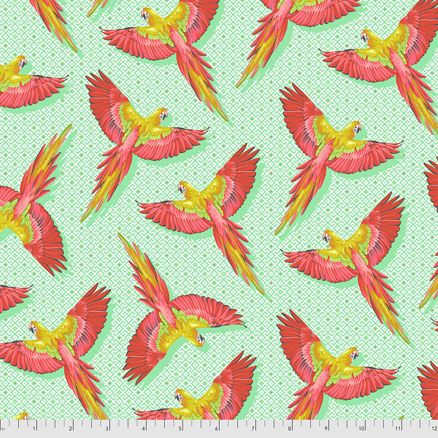 macaw parrots in flight with pink and yellow feathers on a green background.