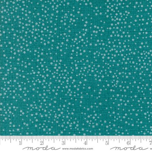 Teal fabric with small white dot pattern