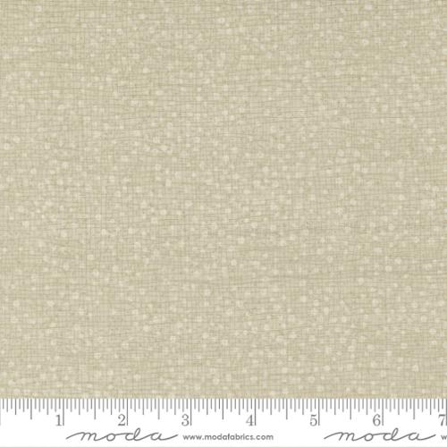 light beige dots on a tan background