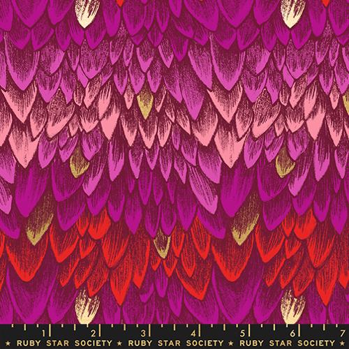Fabric with a pattern of pink, red, and purple scales on a black background,
