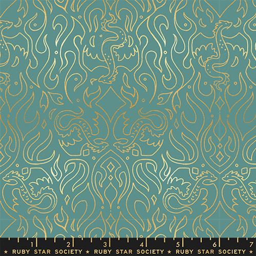 fabric with gold dragon designs on a teal background,