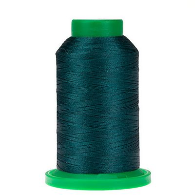 Spool of dark blue/green thread with green cap and bottom of spool