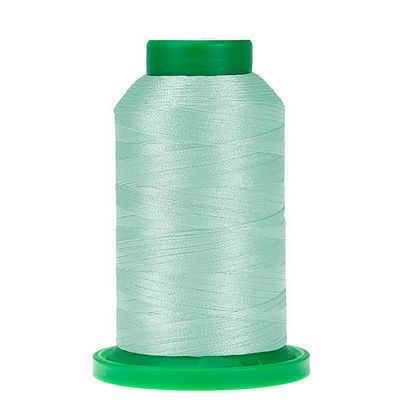 Spool of light blue-green thread with green cap and bottom of spool
