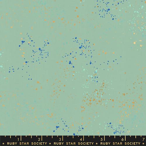 Fabric swatch with blue and gold speckles on a teal background