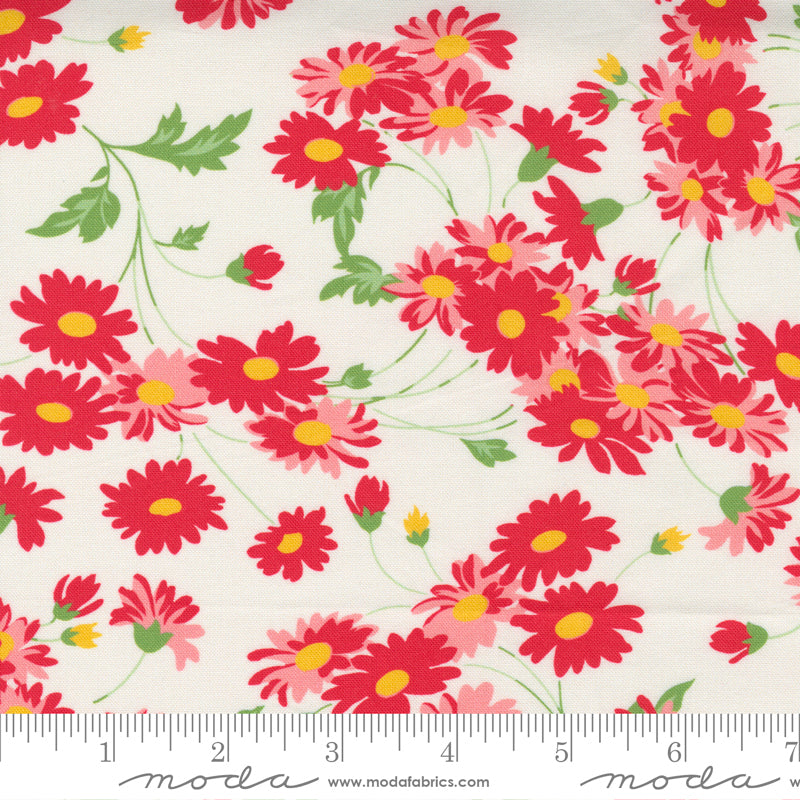 Floral fabric pattern with red and pink flowers on a white background.