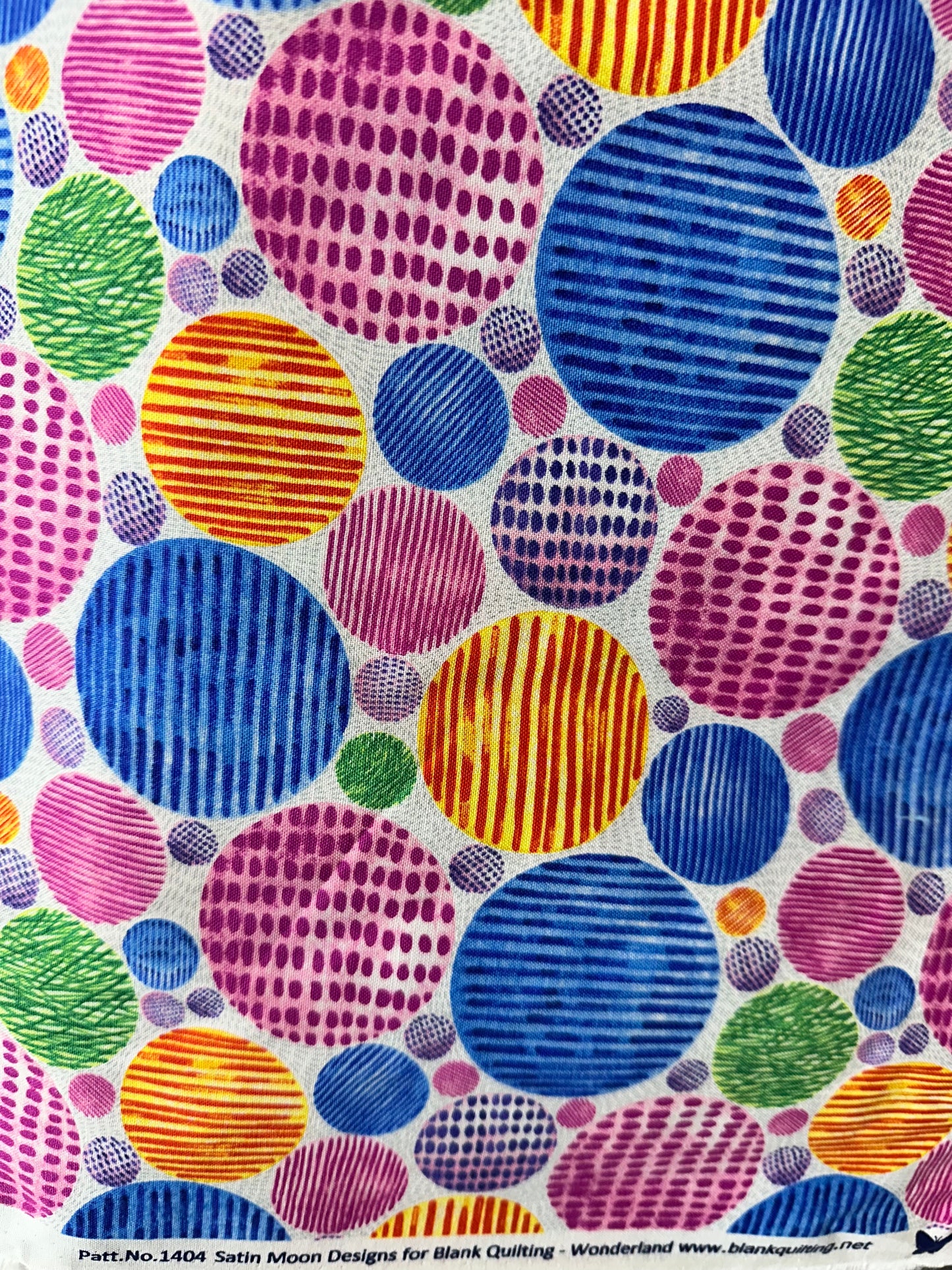 Colorful pattern of circles on a fabric swatch