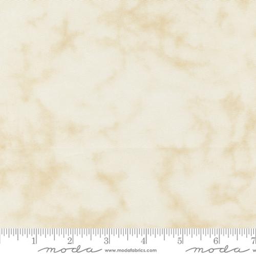 A close-up of a fabric swatch with a warm cream and beige marbled pattern