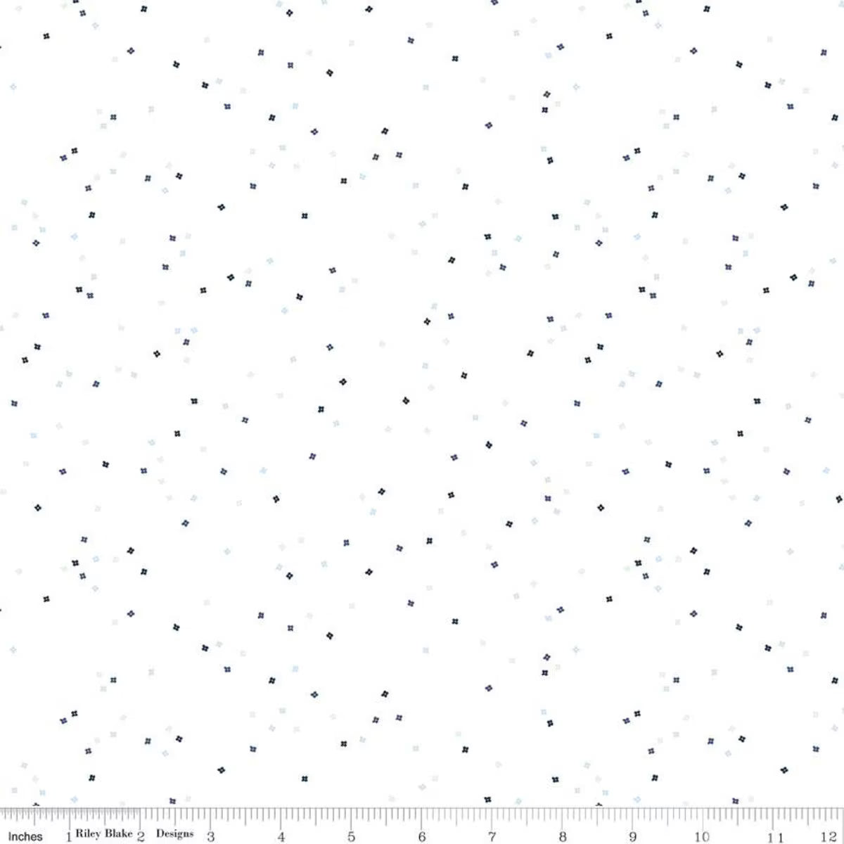 White fabric with a scattered pattern of tiny dark navy and light blue  colored confetti blossoms 