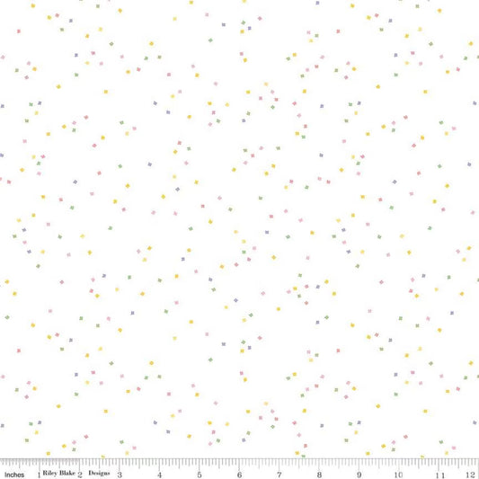  tiny pink, yellow, green and purple colored confetti blossoms on a white background
