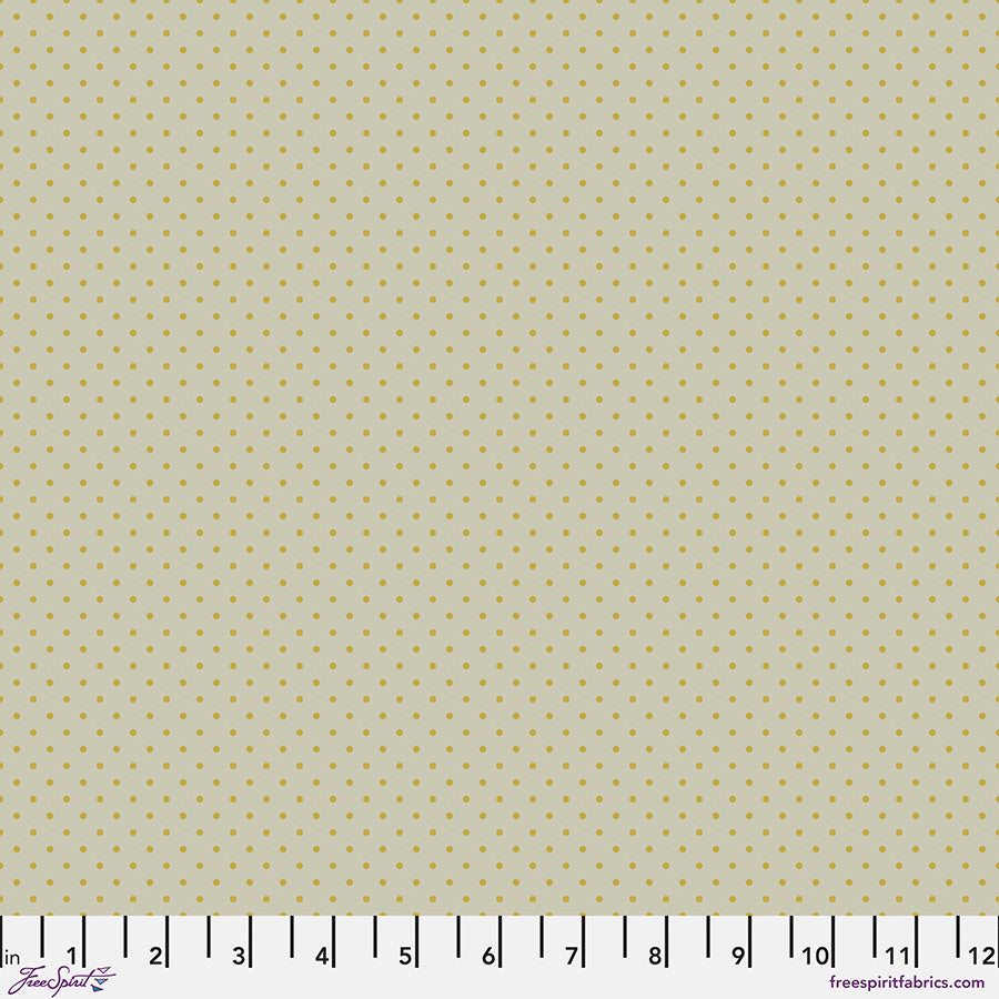 small yellow dots on a light beige background