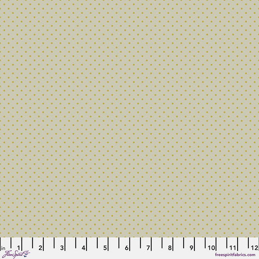 small yellow dots on a light beige background
