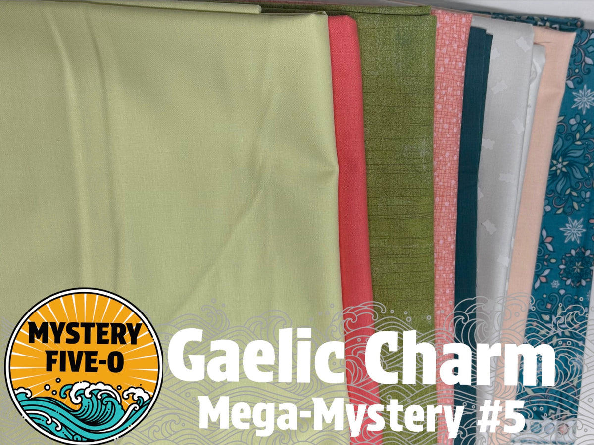 A bundle of fabric samples fanned out, with the largest piece in pale sage green in front. Visible colors and patterns include coral red, olive green, pink, dark teal, light gray, peach, and blue floral.
