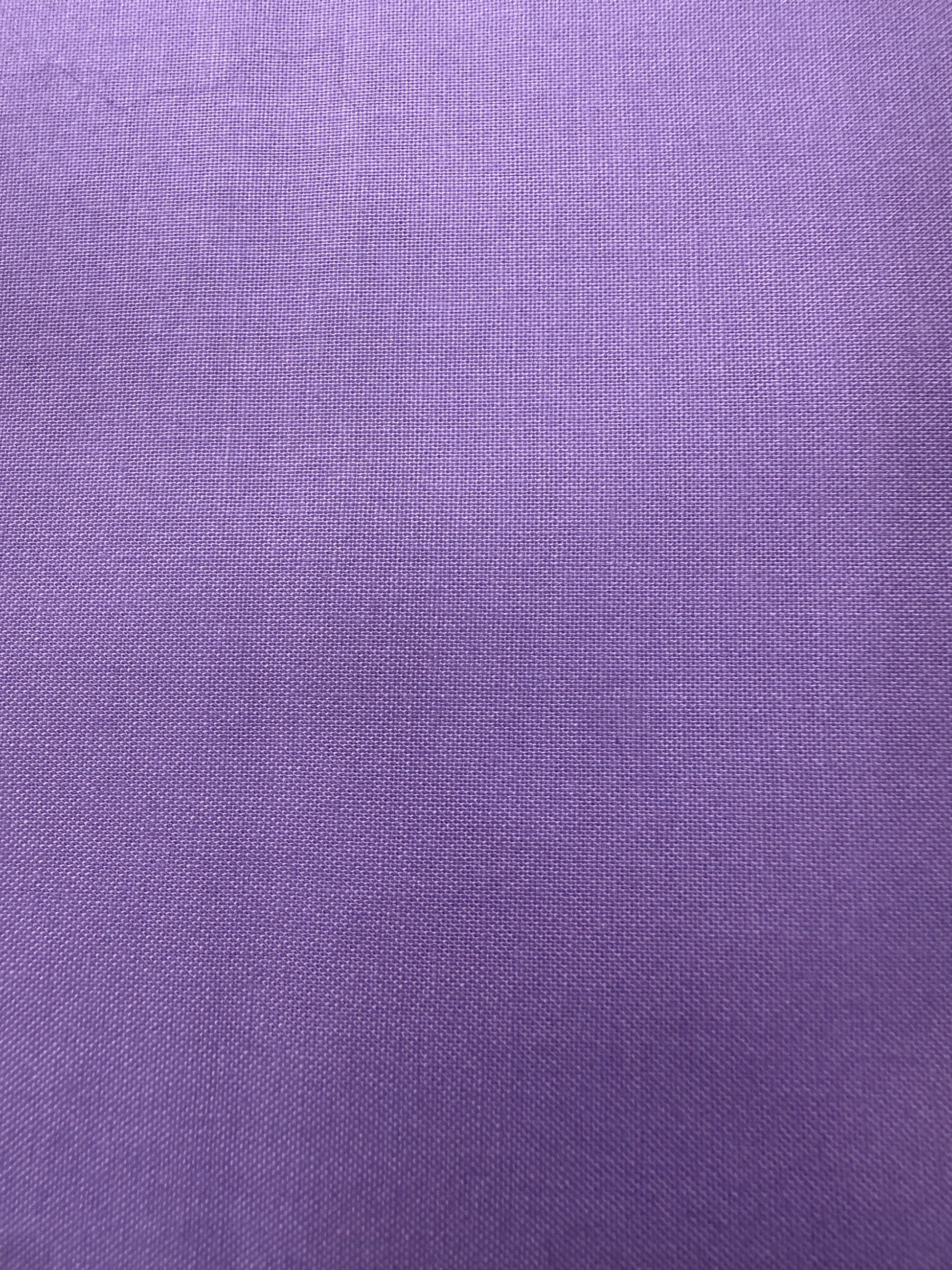 A close-up of a purple woven fabric 