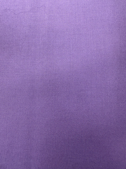 A close-up of a purple woven fabric 