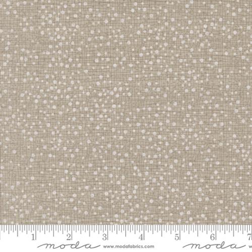 light beige dots on a light brown background