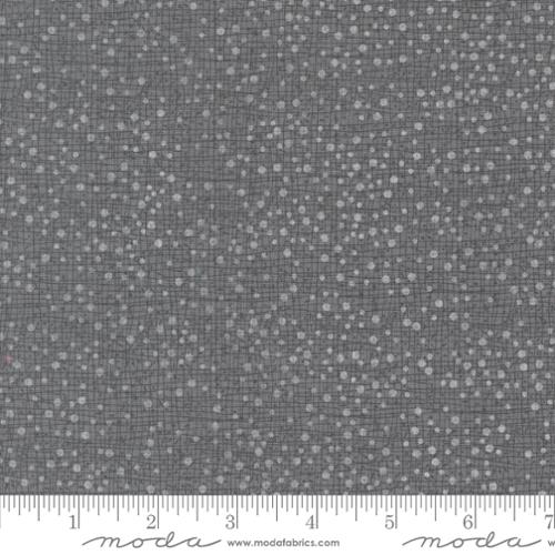 light gray dots on a gray background