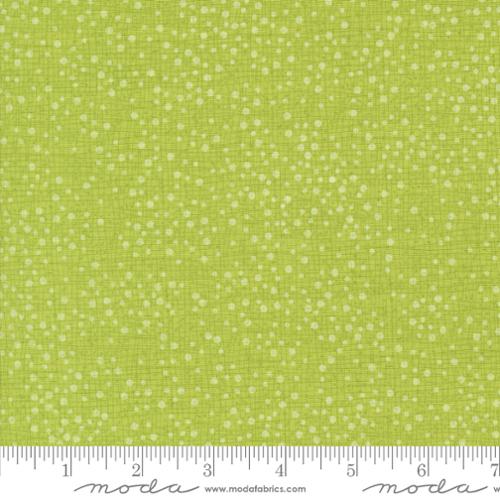 Green fabric with white dot pattern