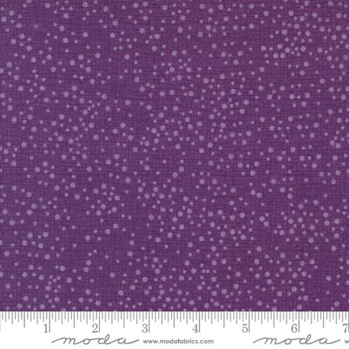 light purple tiny dots on a purple background