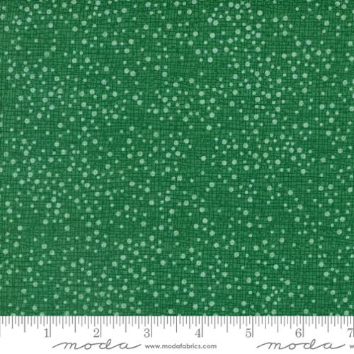 light green dots on a green background