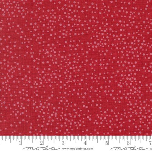 pink tiny dots on a red background