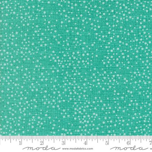 light dots on an aqua background