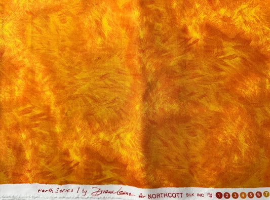 Close-up of textured yellow/orange fabric.