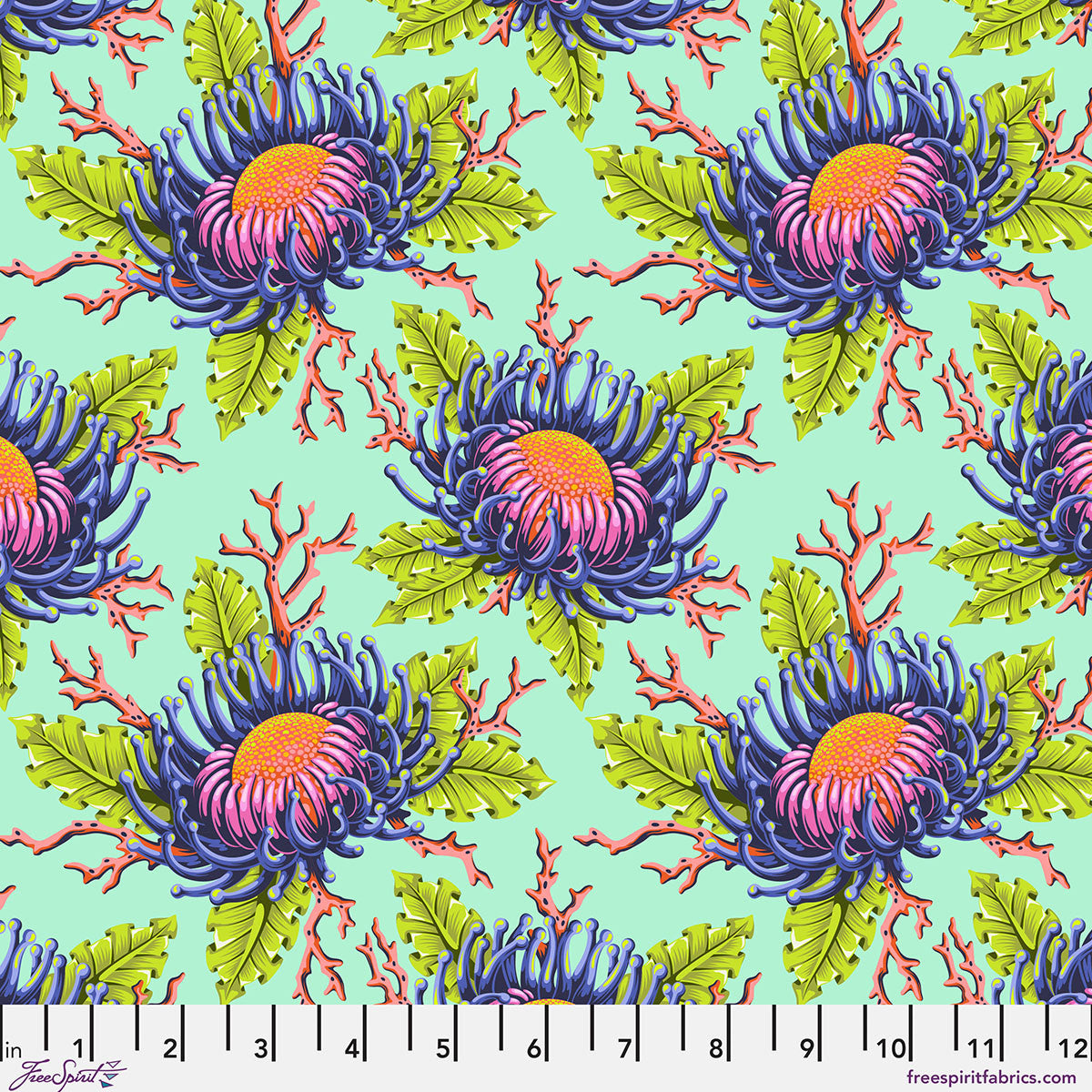 Pattern of colorful flowers and leaves on a turquoise background.