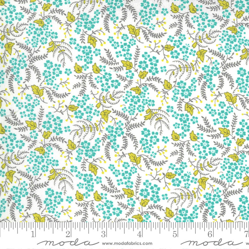 Floral pattern fabric with aqua flowers and green leaves on a white background.