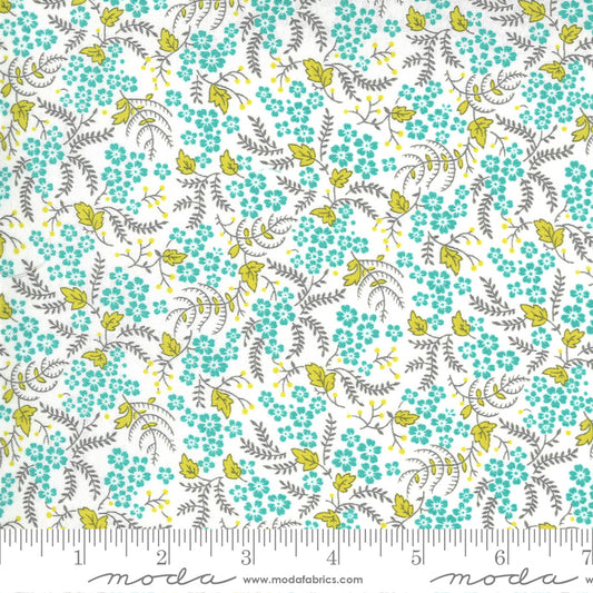 Floral pattern fabric with aqua flowers and green leaves on a white background.