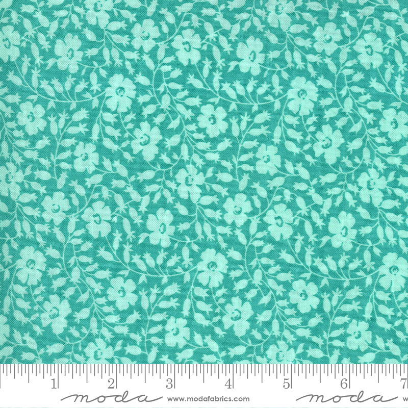 Teal floral pattern on an aqua background