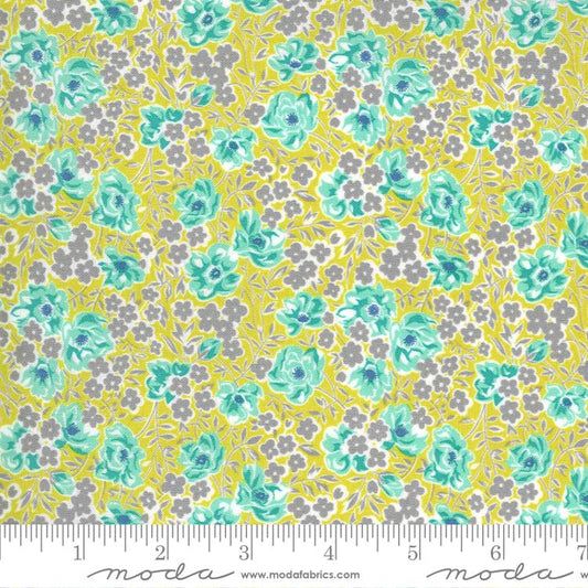 Floral fabric pattern with gray and aqua colors on a yellow background.