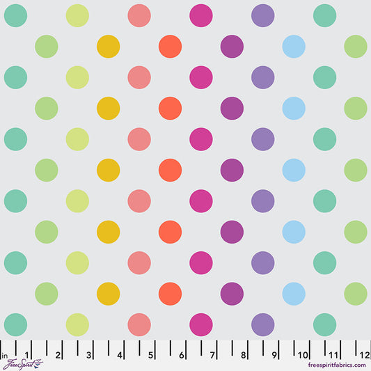 Pattern of colorful polka dots on a white background with a ruler at the bottom.