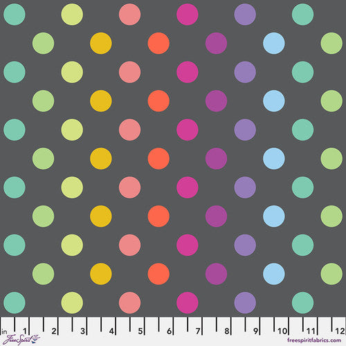 Colorful polka dot pattern on a gray background with a ruler at the bottom.