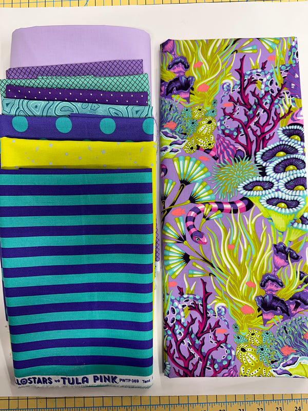 This kit is pure Tula Pink underwater magic! The vibrant coral reef print paired with electric aqua, deep violet, bright chartreuse, and lavender creates a bold, tropical ocean palette that feels like diving into a colorful reef just below the waves.