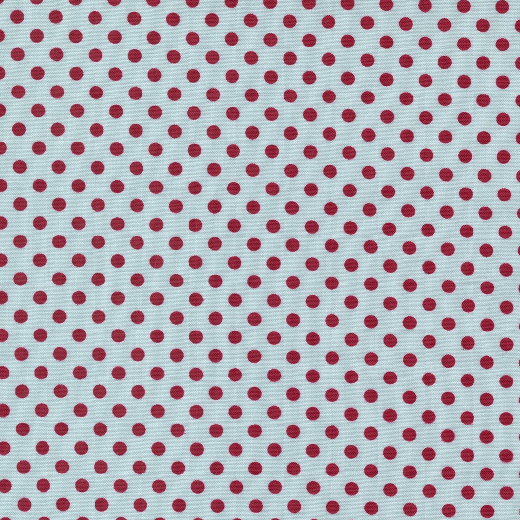 Pattern of red polka dots on a light blue background