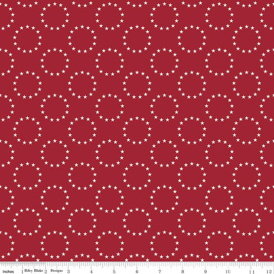  Offset rows of circles of 13 small white stars on a red background.