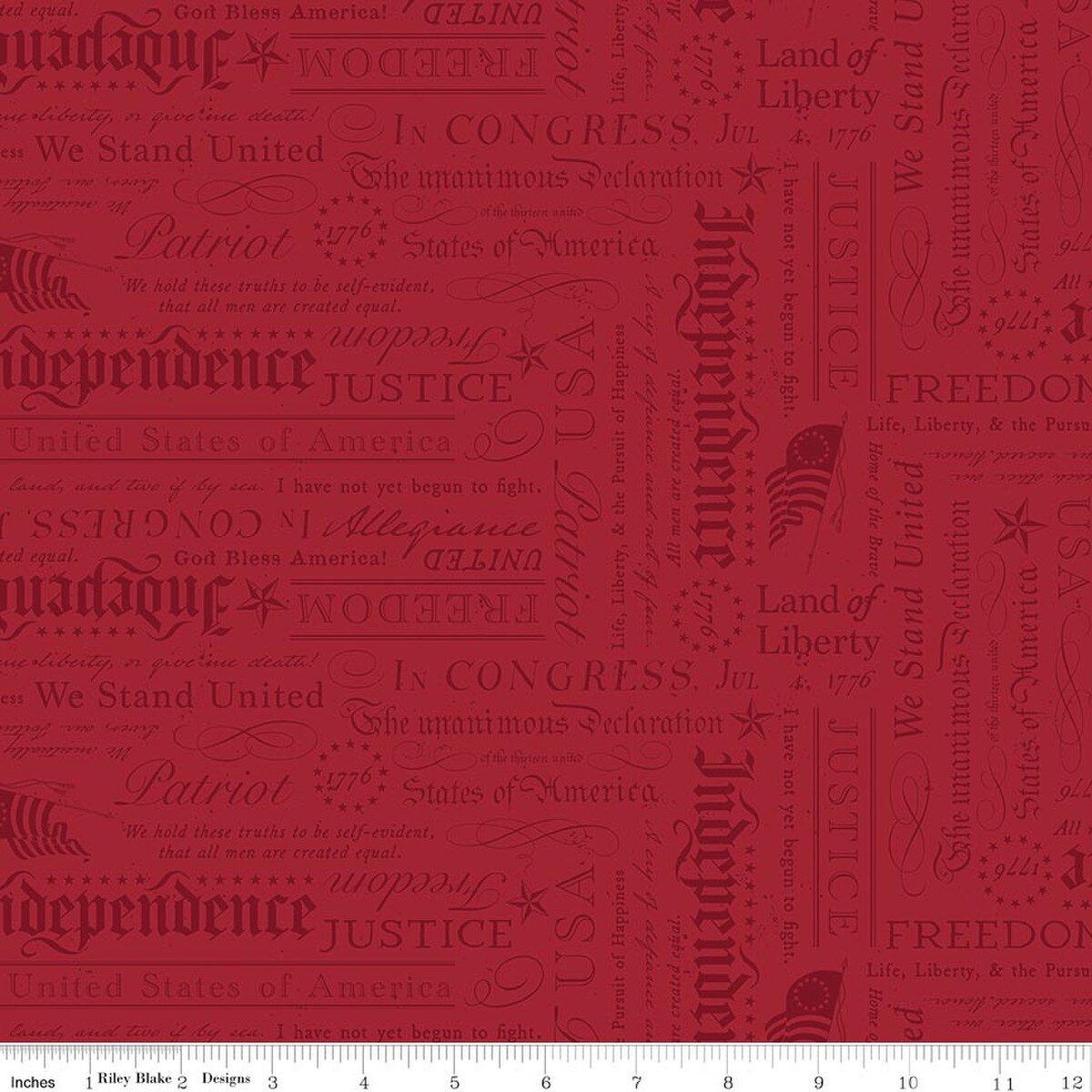 A close-up of a repeating fabric pattern featuring vintage American-themed typography with words like 'Independence,' 'Liberty,' 'Justice,' 'Patriot,' and 'We Stand United' in muted red tones on a warm red background.