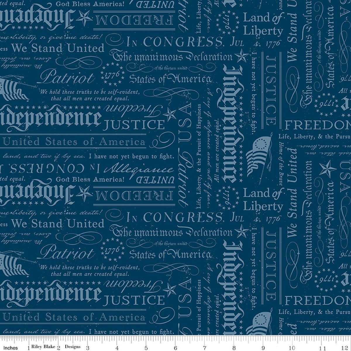 A close-up of a repeating fabric pattern featuring vintage American-themed typography with words like 'Independence,' 'Liberty,' 'Justice,' 'Patriot,' and 'We Stand United' in muted light blue tones on a blue background.