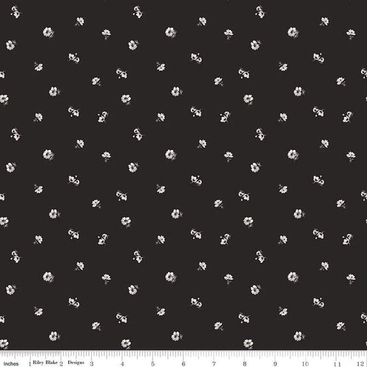 Black fabric with a repeating white floral pattern