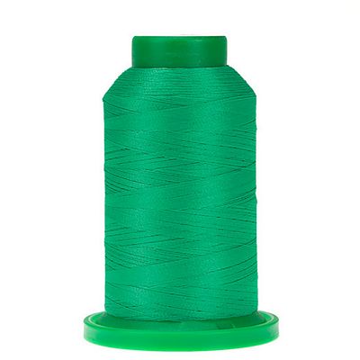 Spool of green  thread with green cap and bottom of spool