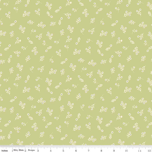 A repeating fabric pattern of small white flowers and leaves on a light olive green background