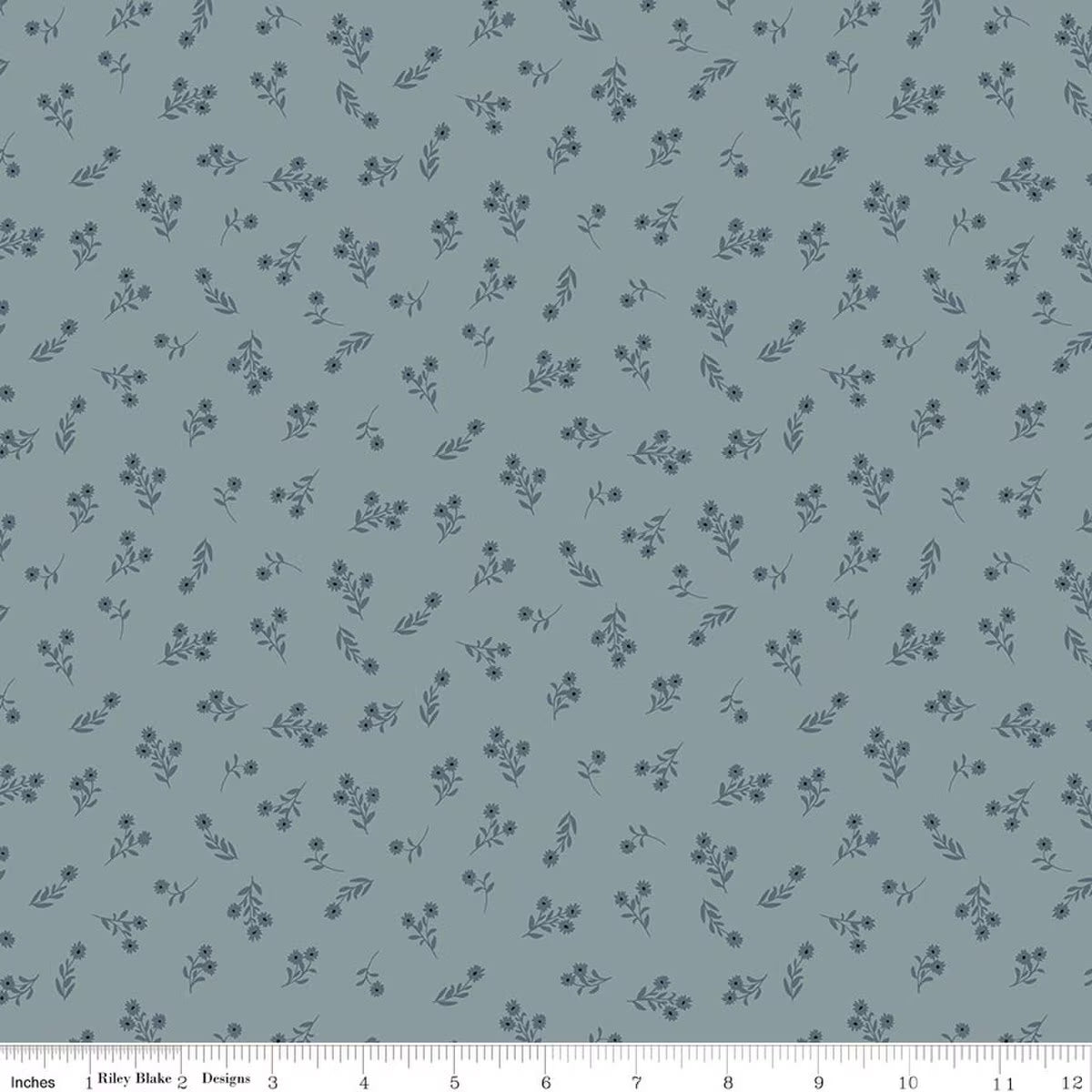 A repeating floral pattern on a muted blue-gray background, with small dark blue flowers and leaves