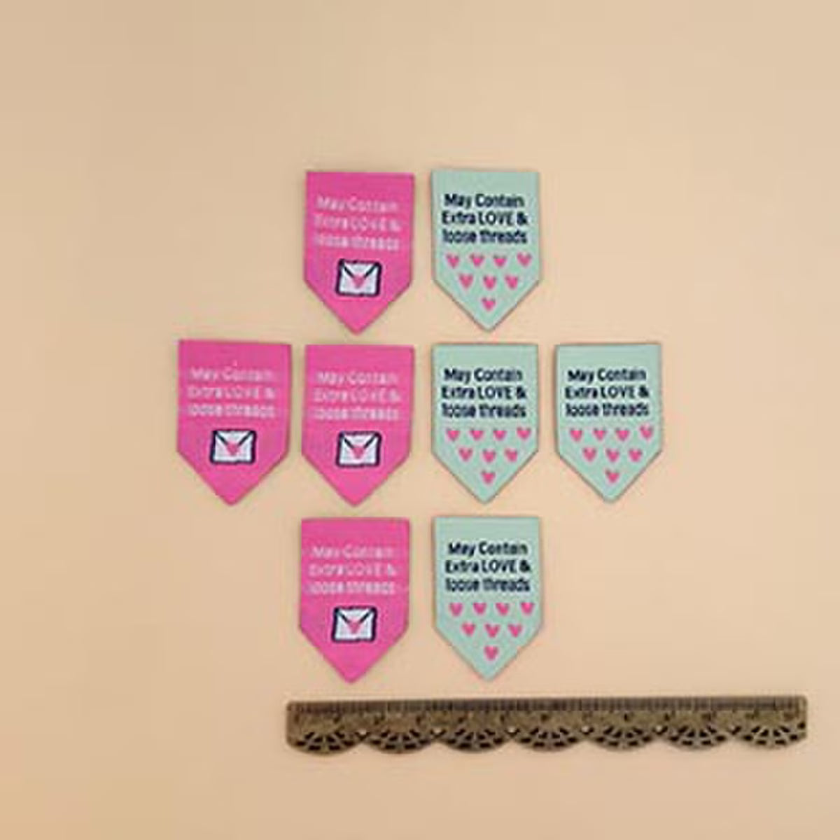 Set of pink and blue fabric flags with text 