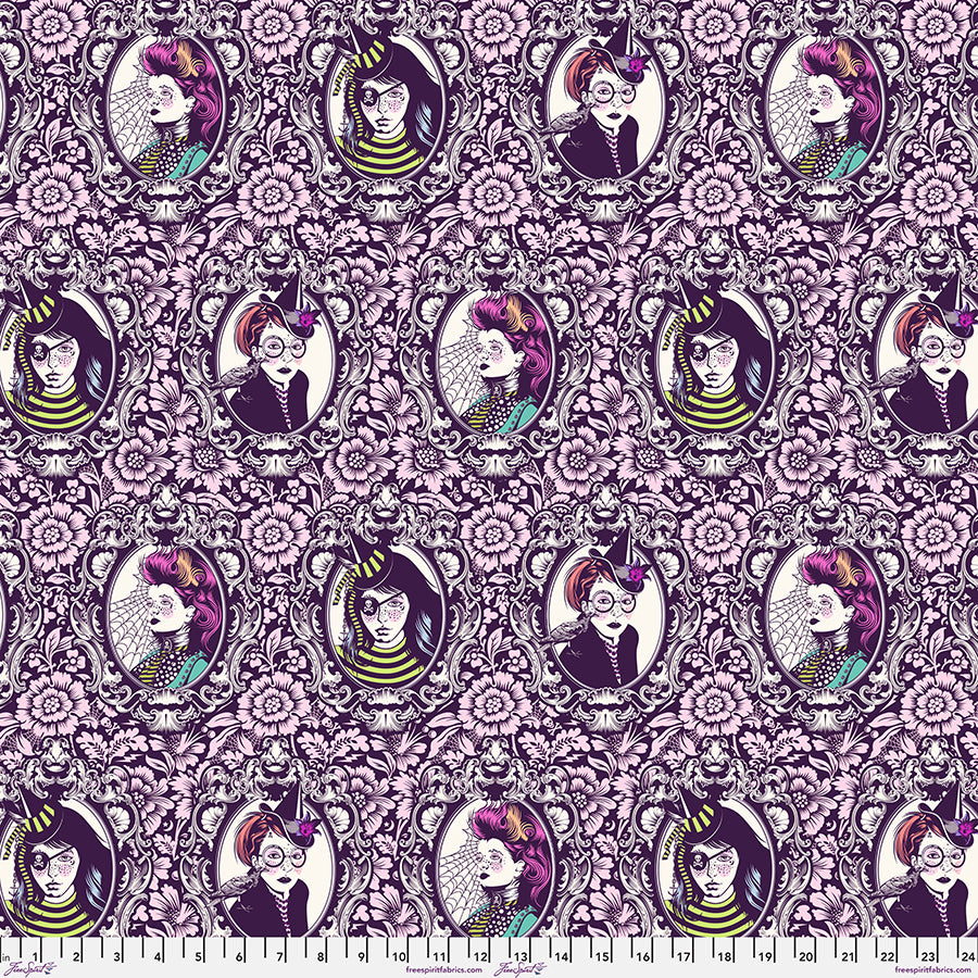 Patterned fabric with illustrated portraits and floral designs on a pink background