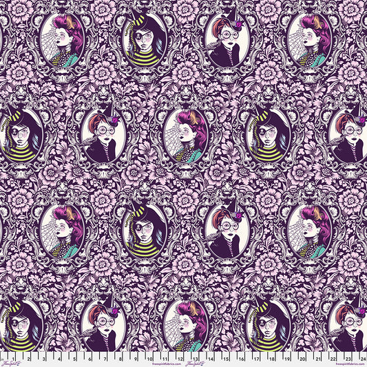 Patterned fabric with illustrated portraits and floral designs on a pink background