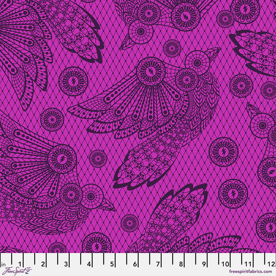 Decorative fabric with black lace-like patterns on a pink background
