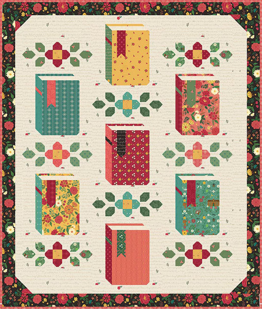 A quilt pattern or fabric design featuring stylized books and floral motifs arranged between the books with a  border. 