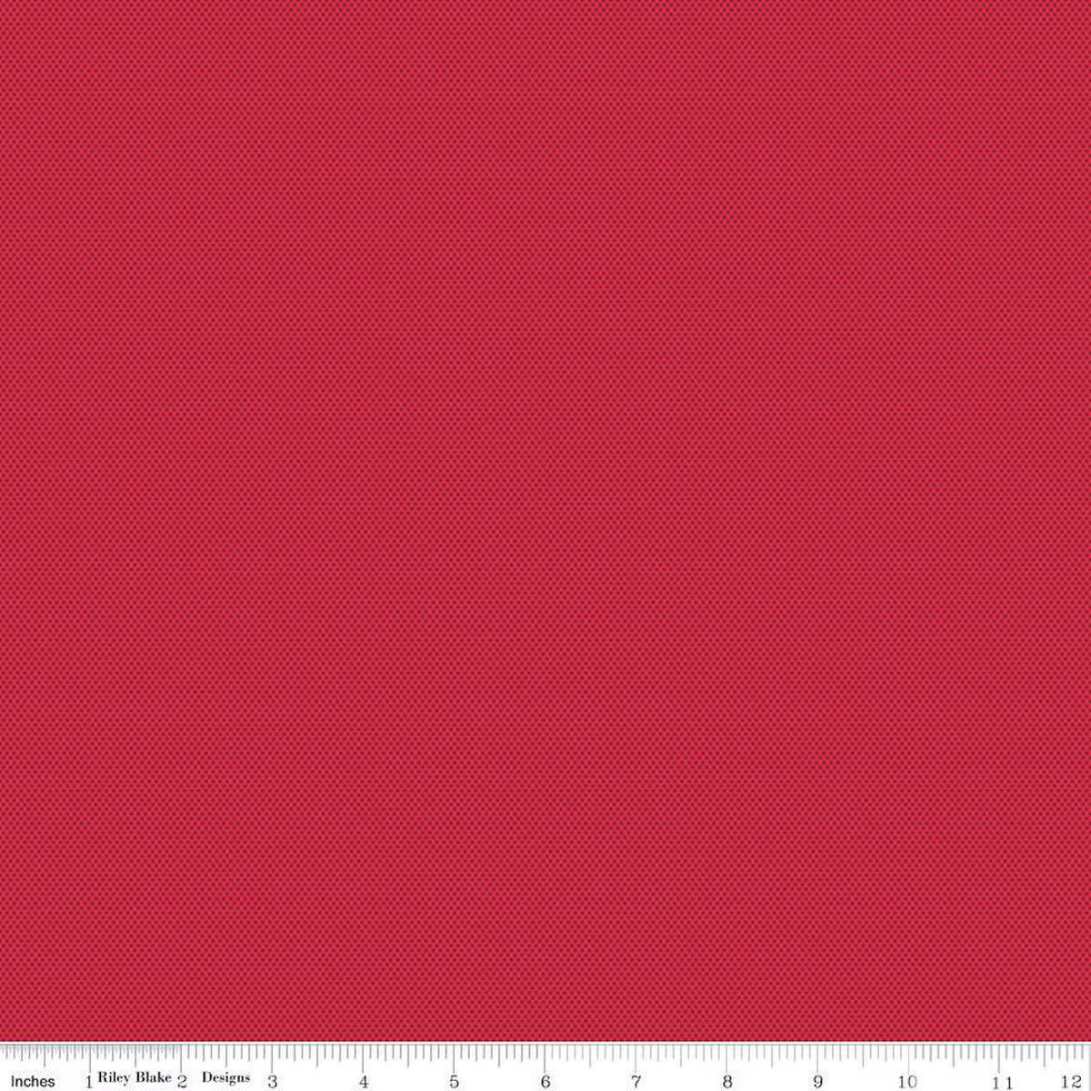 A close-up of a red tiny dotted fabric 