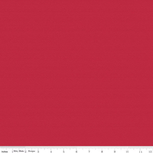 A close-up of a red tiny dotted fabric 